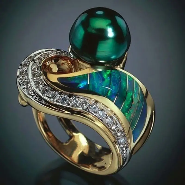 Retro-Ring mit grünen Brillanten