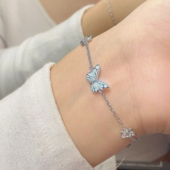 Set Halskette und Armband mit leuchtendem blauen Schmetterling