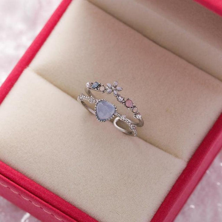Verstellbarer Weissgoldring mit blauem Stein